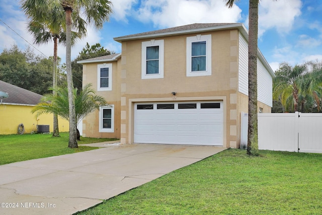 view of front of property featuring central AC unit, a garage, and a front lawn