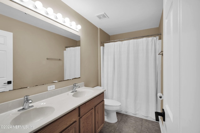 bathroom with tile patterned floors, vanity, curtained shower, and toilet