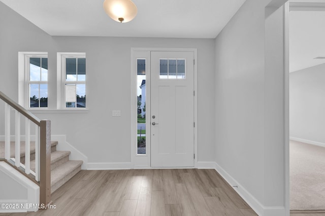 118 Caiden Dr, Ponte Vedra, FL 32081 - entrance foyer featuring healthy amount of natural light, wood finished floors, baseboards, and stairway