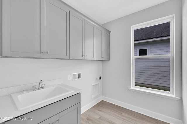 118 Caiden Dr, Ponte Vedra, FL 32081 - laundry room with hookup for a washing machine, hookup for an electric dryer, baseboards, cabinet space, and light wood finished floors