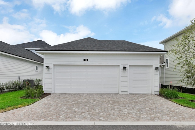 118 Caiden Dr, Ponte Vedra, FL 32081 - garage with decorative driveway and cooling unit