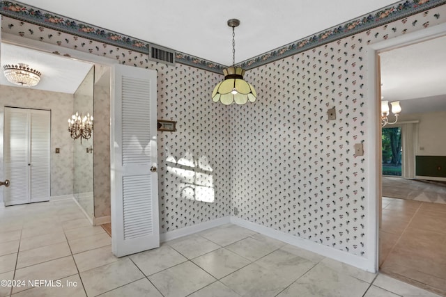 unfurnished dining area featuring light tile patterned floors