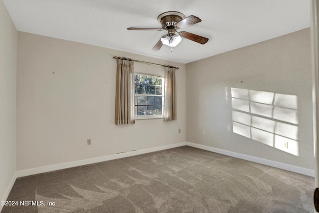 carpeted empty room with ceiling fan