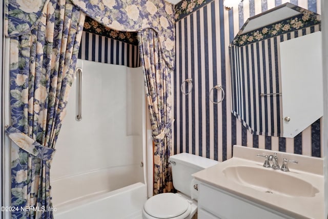 full bathroom featuring vanity, toilet, and shower / tub combo with curtain