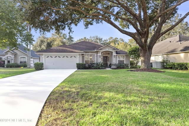 ranch-style home with a garage and a front yard