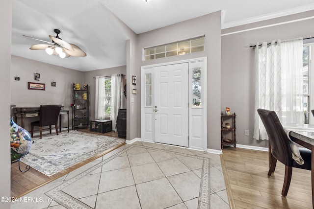 foyer entrance featuring ceiling fan and light hardwood / wood-style flooring