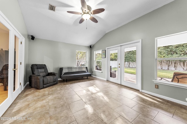 unfurnished room featuring french doors, ceiling fan, vaulted ceiling, and light tile patterned floors