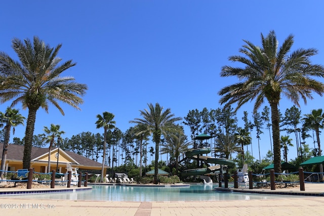 view of pool with a water slide