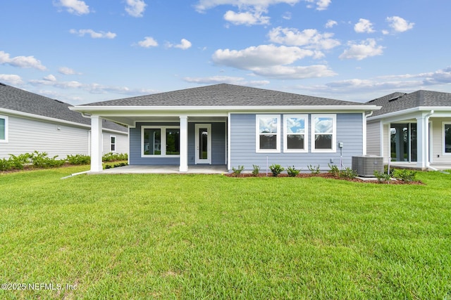 75484 Banyan Way, Yulee, FL 32097 - back of property with central AC, a lawn, and a patio