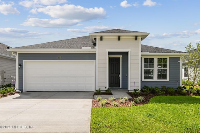 75484 Banyan Way, Yulee, FL 32097 - view of front of home with driveway, a front lawn, a garage, and a shingled roof