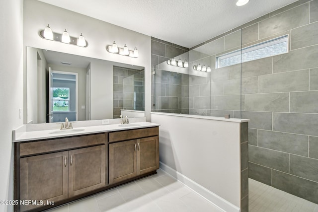 75484 Banyan Way, Yulee, FL 32097 - full bathroom with plenty of natural light, walk in shower, double vanity, a textured ceiling, and tile patterned floors