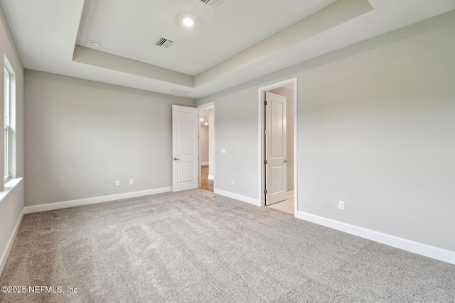75484 Banyan Way, Yulee, FL 32097 - unfurnished bedroom featuring a raised ceiling, carpet, and baseboards