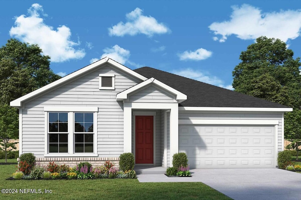 view of front of house with a front lawn and a garage