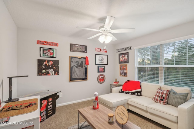 carpeted living room with a textured ceiling and ceiling fan