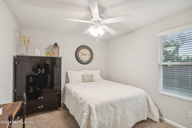 bedroom featuring light carpet and ceiling fan