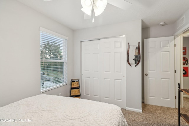 bedroom featuring carpet floors, a closet, and ceiling fan