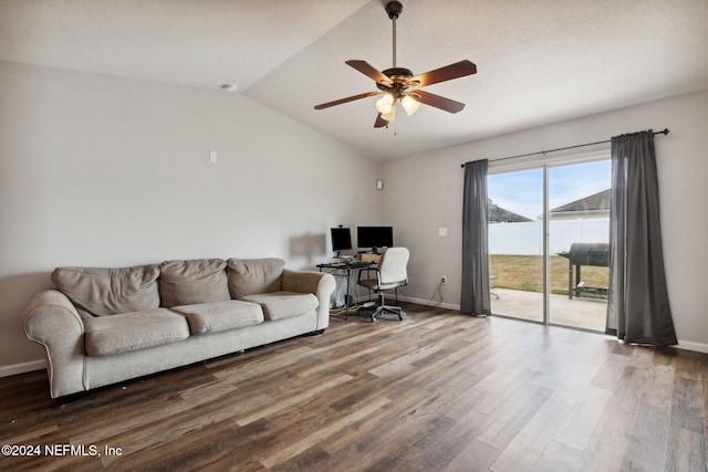 living room with hardwood / wood-style floors, ceiling fan, and lofted ceiling