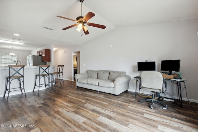 office with ceiling fan, hardwood / wood-style floors, and lofted ceiling