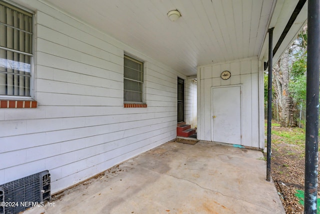 entrance to property featuring a patio area