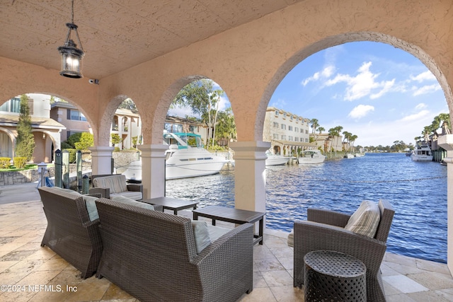 view of patio with a water view