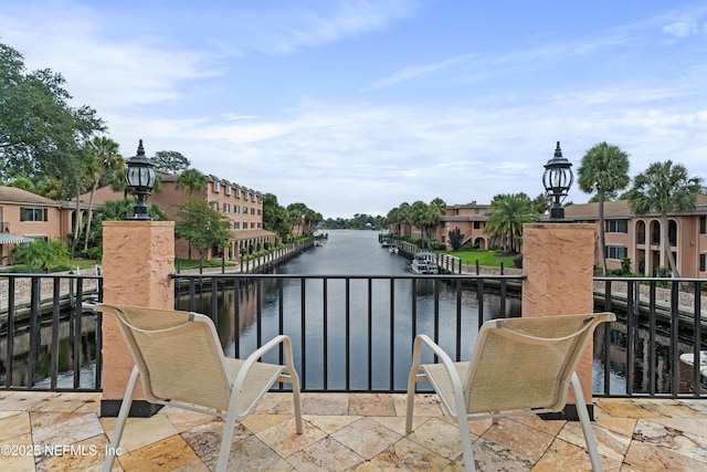 balcony featuring a water view