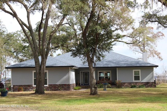 back of house with a yard