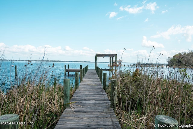 view of dock with a water view