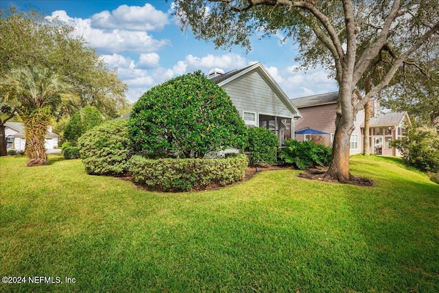 view of yard featuring a sunroom