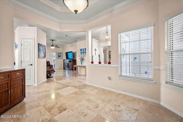 entrance foyer featuring ceiling fan with notable chandelier and ornamental molding