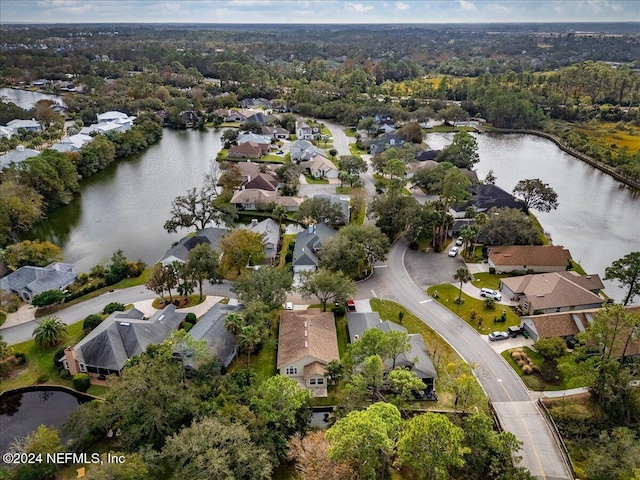 aerial view featuring a residential view and a water view