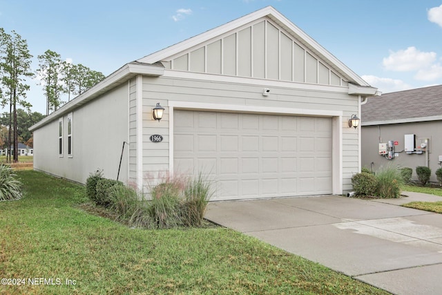 exterior space featuring a front yard and a garage