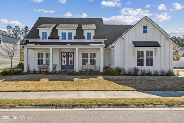 view of front of house featuring a front lawn and a porch