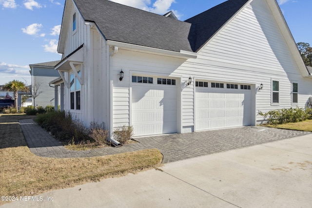 view of property exterior with a garage