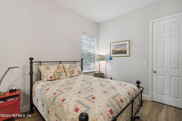 bedroom featuring dark hardwood / wood-style floors