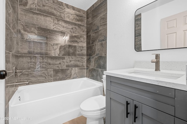 bathroom with toilet, tub / shower combination, and vanity