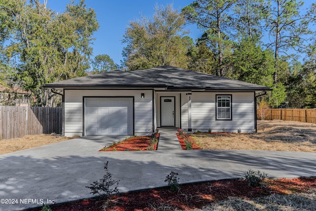 single story home featuring a garage