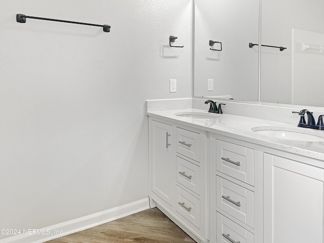 bathroom featuring vanity and wood-type flooring