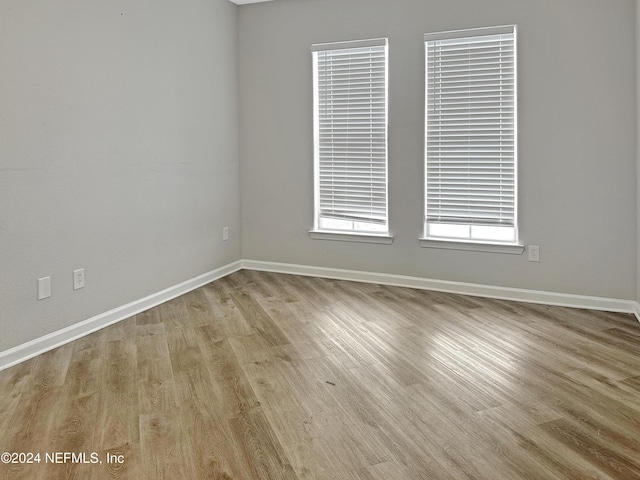 empty room with light wood-type flooring