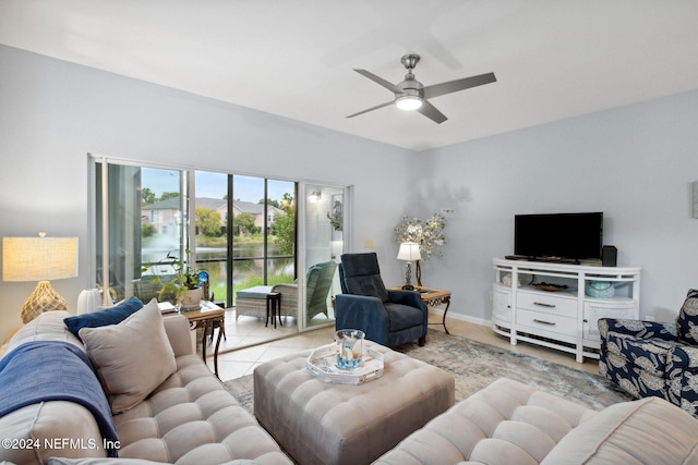 tiled living room with ceiling fan