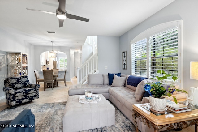 living room featuring ceiling fan and light tile patterned floors