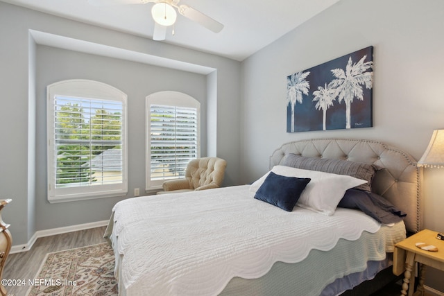 bedroom featuring hardwood / wood-style flooring and ceiling fan