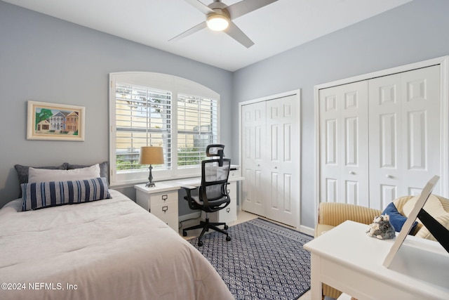 bedroom featuring two closets and ceiling fan