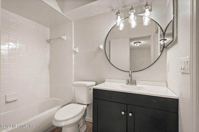 full bathroom featuring bathing tub / shower combination, hardwood / wood-style flooring, vanity, and toilet