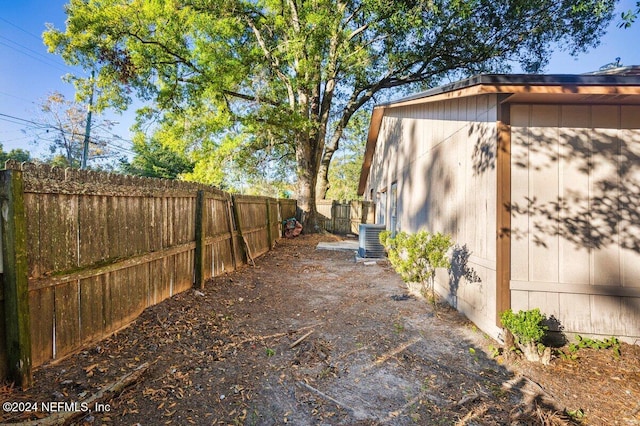 view of yard with central AC unit