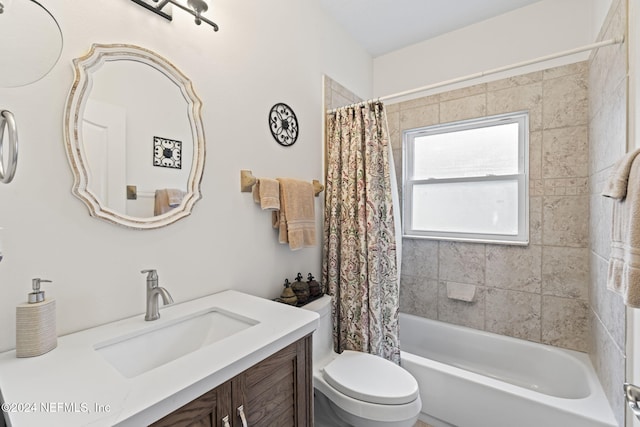 full bathroom featuring vanity, shower / bath combo, and toilet