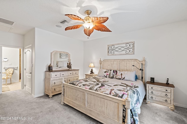 bedroom with light carpet and ceiling fan