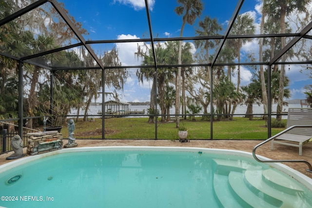 view of swimming pool featuring glass enclosure