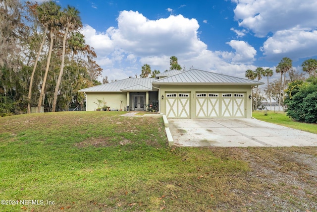 view of front facade with a front lawn and a garage