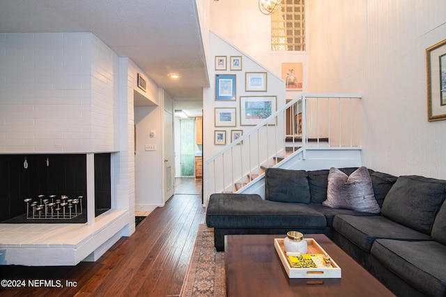 living room with dark hardwood / wood-style flooring