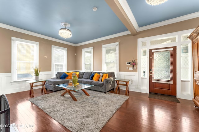 living room with dark hardwood / wood-style flooring and crown molding